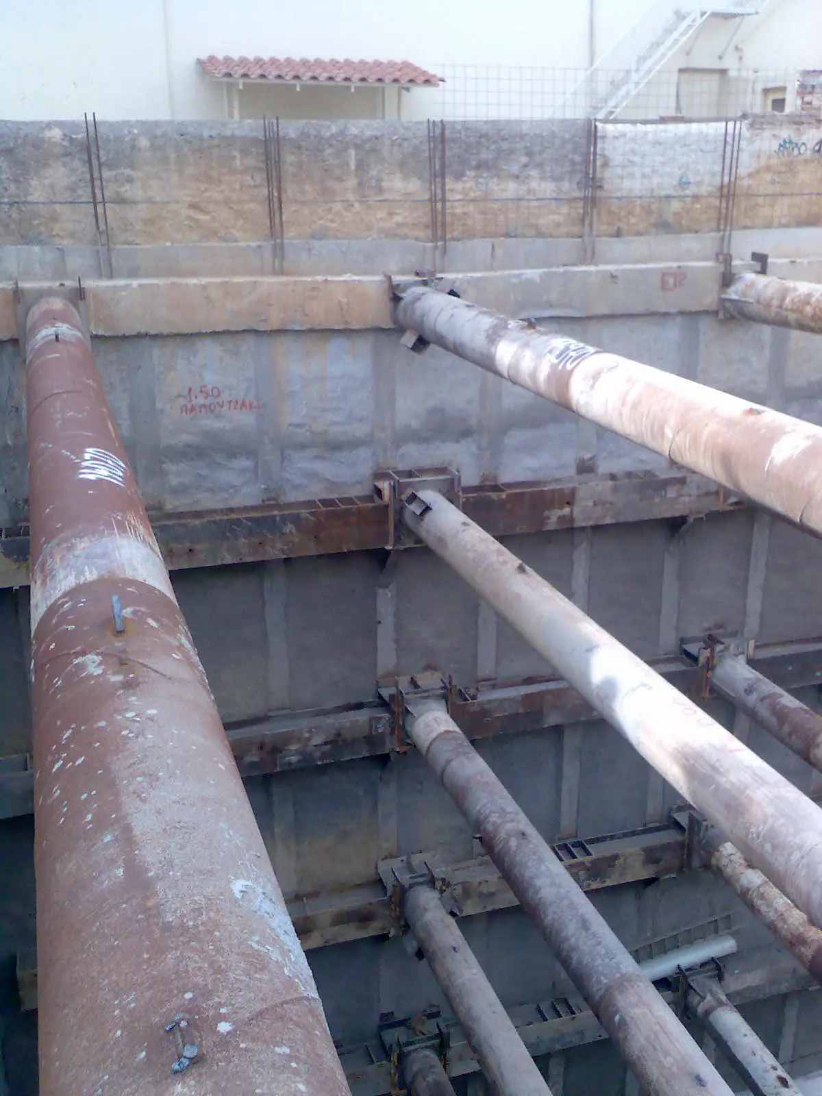 Braced deep excavation with steel struts and walers in an urban site